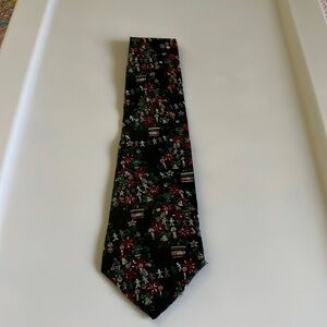 Damani men’s Christmas tie. The color is black decorated with poinsettias.